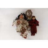 Two Canadian dolls in native costume, with drum bangle dream catcher,
