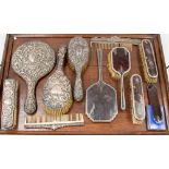 A bag of silver backed dressing table items, non matching, some tortoiseshell,