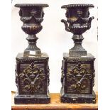 A pair of Victorian cast iron pedestal urn,