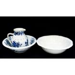 A blue/white wash bowl and matching jug together with another bowl,