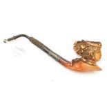 A 19th Century Meerschaum pipe with a carved ladies head, well used with patina and handling wear,