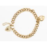 A 9ct gold curb link padlock clasp bracelet, with 9ct gold heart charm, approx weight 11.