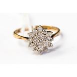 An 18ct gold and diamond cluster ring, the setting measuring approx 10mm,