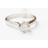 A platinum diamond ring, claw set with a princess cut diamond approx weight 0.