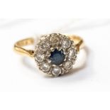 An 18ct gold diamond and sapphire daisy cluster ring, size K, with a total gross weight of approx 3.