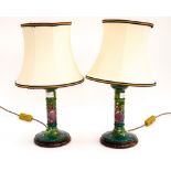 A pair of Moorcroft table lamps, Finches and berries pattern, on green ground,