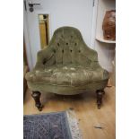 A 19th Century deep buttoned green upholstered corner chair
