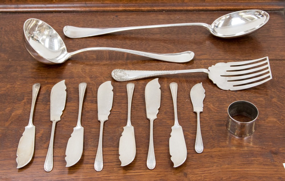 Eight Mappin and Webb 'Princess plate' knives with an EPNS ladle,