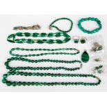 A bag of malachite necklaces, bracelets,