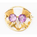An amethyst 9ct yellow gold thistle design brooch, with a length of approx 30mm,