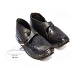 A pair of children's leather cloggs/shoes from 1860/70, tiny hole in toe,