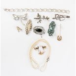 A collection of silver, gold and costume jewellery to include Victorian silver brooch,
