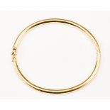A 14ct gold hollow hinged bangle, with a round profile, 3.