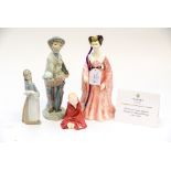 Two Lladro figures, one of a boy with a vegetable basket in hands,