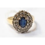 A sapphire and diamond cluster 18ct yellow gold ring,