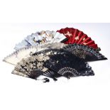 A collection of eight assorted fans, celluloid and wooden sticks, lace, paper and silk,