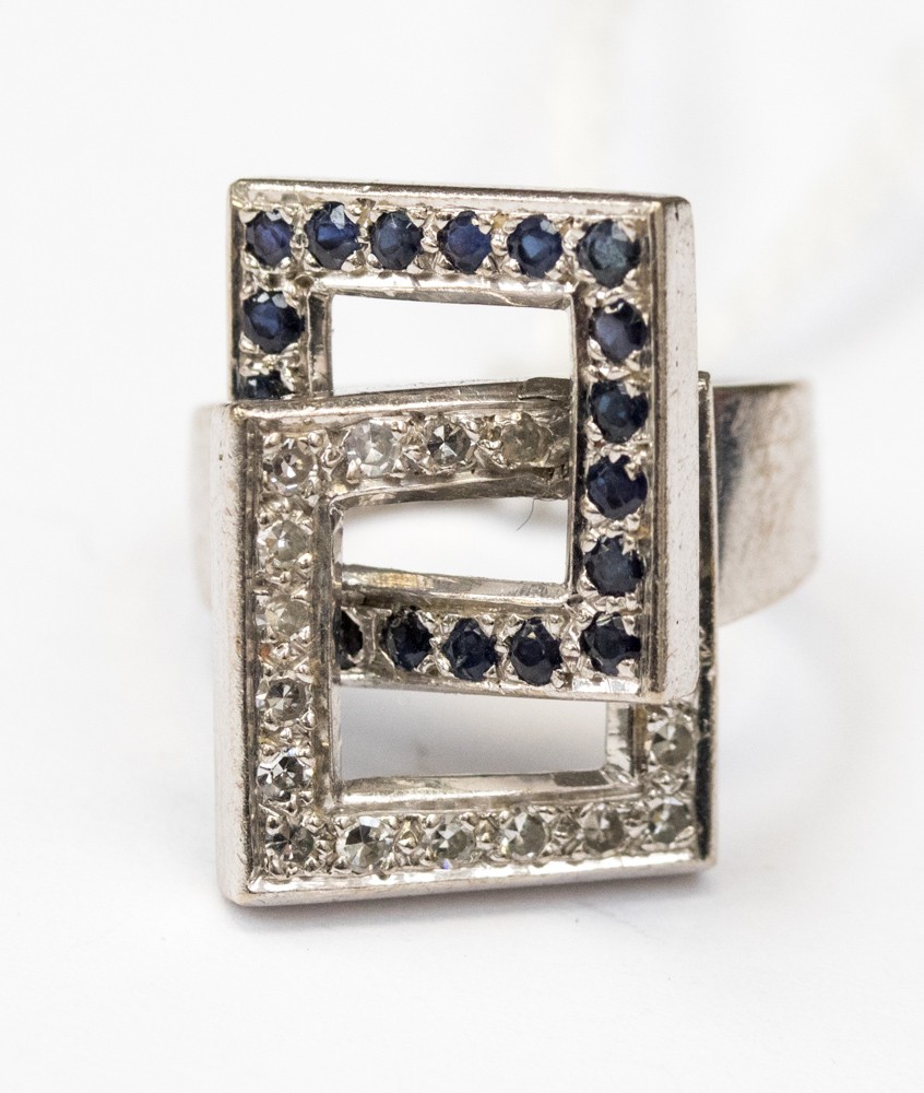 A white metal (possibl;y 18ct gold) diamond and sapphire ladies dress ring,