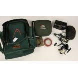 Angling interest: a rucksack containing two ABU Ambassadour fishing reels and three fixed spool
