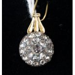 An 19th century diamond and yellow metal silver set cluster pendant, twenty-three rose cut diamonds,