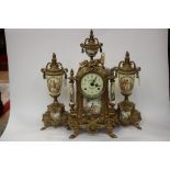 Gilt metal and porcelain clock garniture,