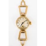 A ladies Vintage Rolex 9ct gold bracelet watch round dial Arabic numerals trapeze shaped rings