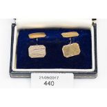 A pair of 9ct gold cuff links, engine turned, approx 2.