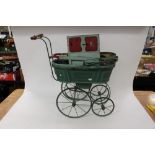 A painted metal dolls pram circa 1883;