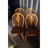 A set of four Windsor style beech chairs,