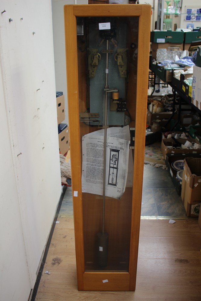 A 1970s GPO electric pulse master slave pendulum clock and two slave clock faces