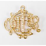 A Christian Dior gilt metal and paste brooch monogram 'C Dior',