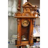A late 19th century walnut Vienna wall clock,
