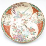 A late 19th century Japanese satsuma charger decorated with Asian pheasants and cherry blossom