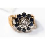 A diamond and sapphire flower cluster ring in 9ct gold,