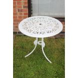 A cast iron white painted garden table