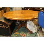 A Victorian walnut and marquetry inlaid loo table