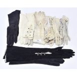 A long pair of kid leather evening gloves, three pairs of kid day gloves,