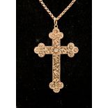 A 9ct rose gold ornate cross, with foliate engraving, approx 50mm,