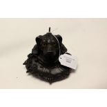 A cast iron inkstand in the form of a dogs head