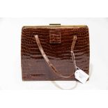 An Asprey of London 1950's handbag in embossed mock crock leather handbag in dark brown with a