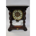 A German striking clock within a mahogany coloured pinewood case circa 1895 daily wind good working