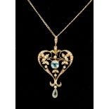 An Edwardian 15ct gold aquamarine and seed pearl pendant on a later plated chain