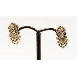 A pair of 14ct Italian diamond earrings with omega clip and pin fastenings,