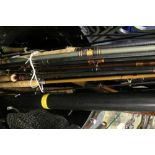 Angling interest: a large collection of fishing rods to include fibre and split cane rods together