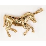 A large 9ct gold horse pendant, set with diamonds, ruby and pink sapphires, measuring approx 4cms,