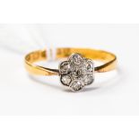 A diamond set flower head ring on 22ct gold shank, size Q, with a total gross weight approx 2.