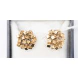 A pair of 9ct gold Modernist clip on earrings, in the form of a cluster of square blocks,