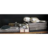 A five piece George V silver mounted dressing table set,