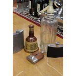 A 62/3 floz 70% Bells Whiskey (Wade Bell), a Schweppes soda water siphon,