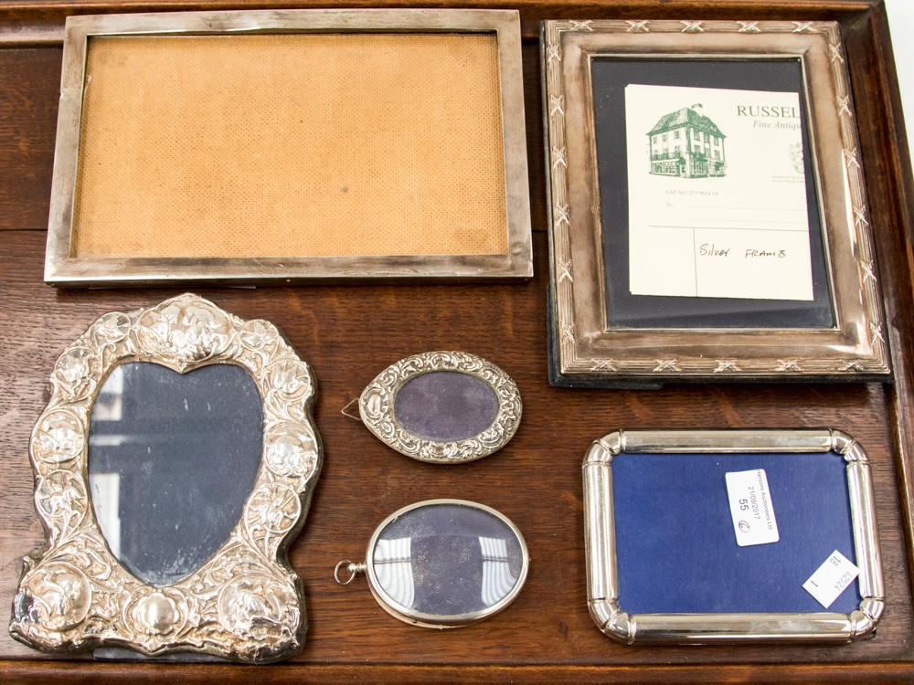 A box of four silver and two white metal picture frames (6)