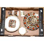 A box of Royal Crown Derby Imari, seconds, including a fruit bowl, two dinner plates, two cups,